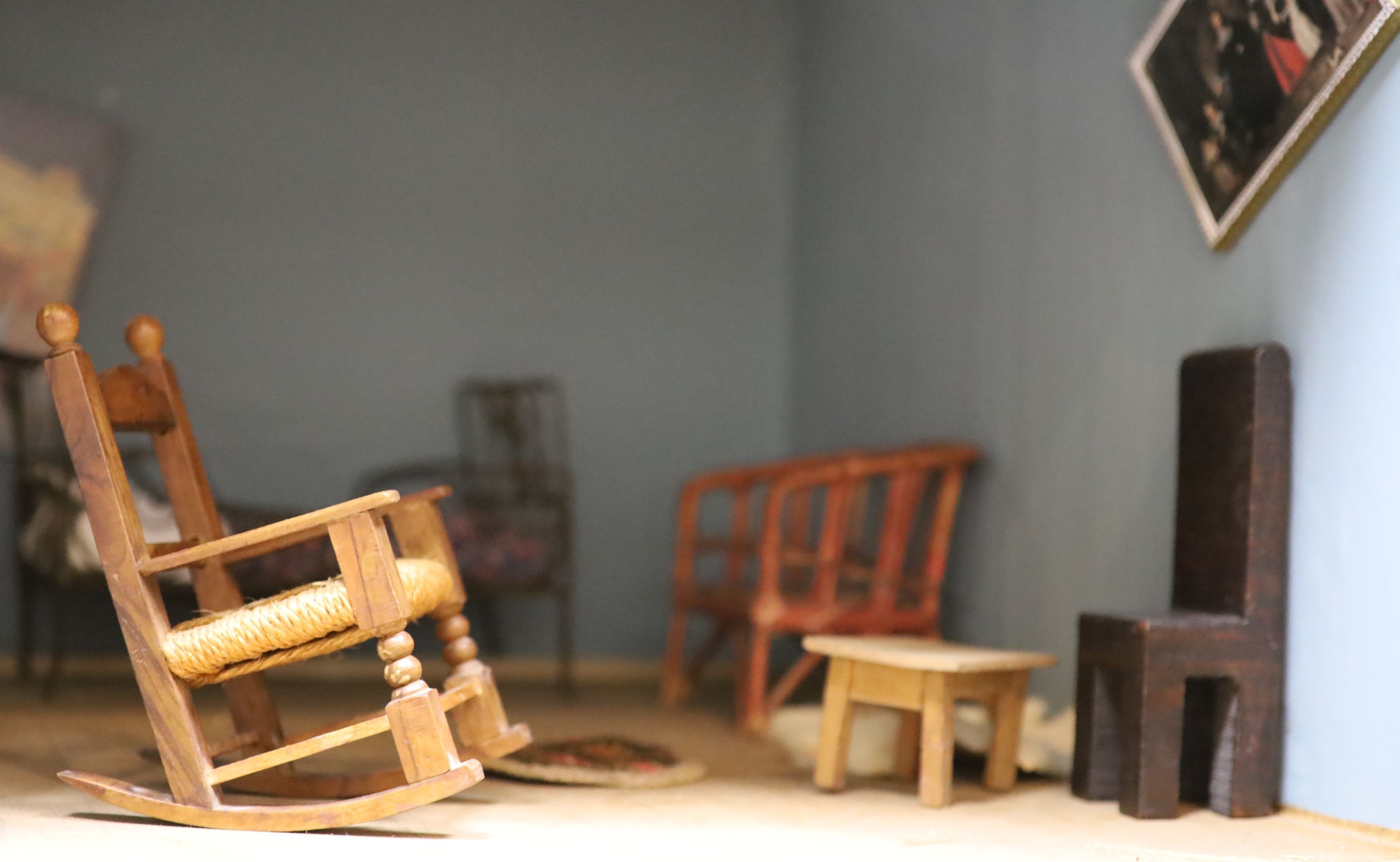 An unusually large painted pine doll's house, modelled upon a Victorian lodge house, Estate Carpenter made, Lake District width 198cm height 156cm